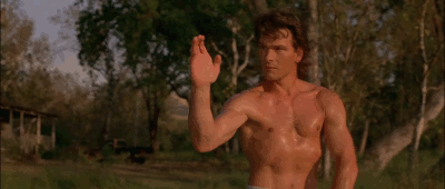 Gif of an oiled up Patrick Swayze preparing to deliver a roundhouse kick